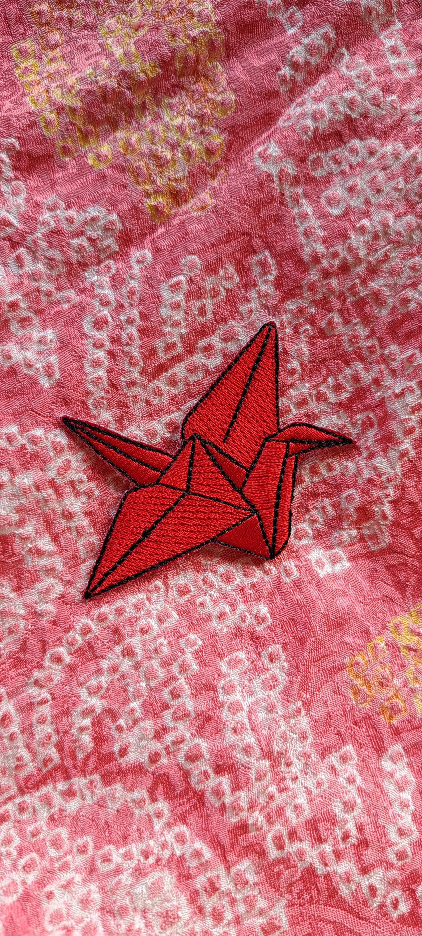 Red crane origami signifies fortune, long life and love